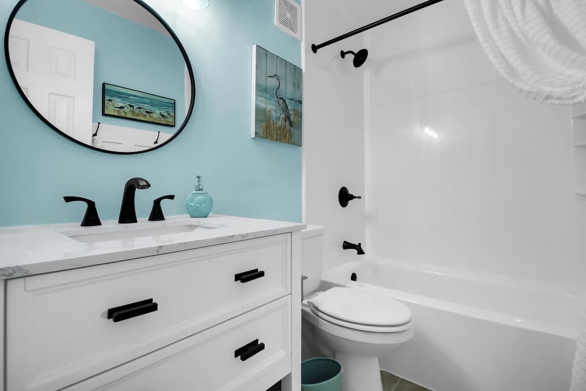Guest bathroom with modern fixtures and coastal accents