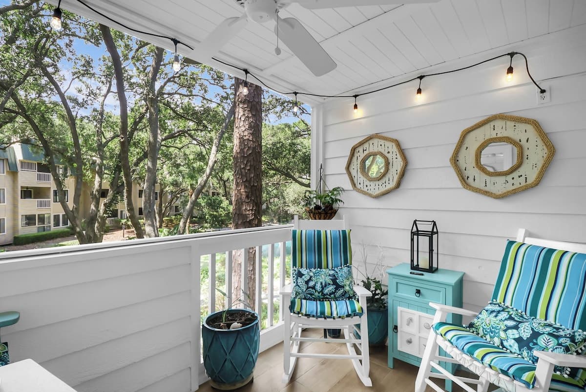 Property grounds with covered porch, ceiling fan, and garden courtyard